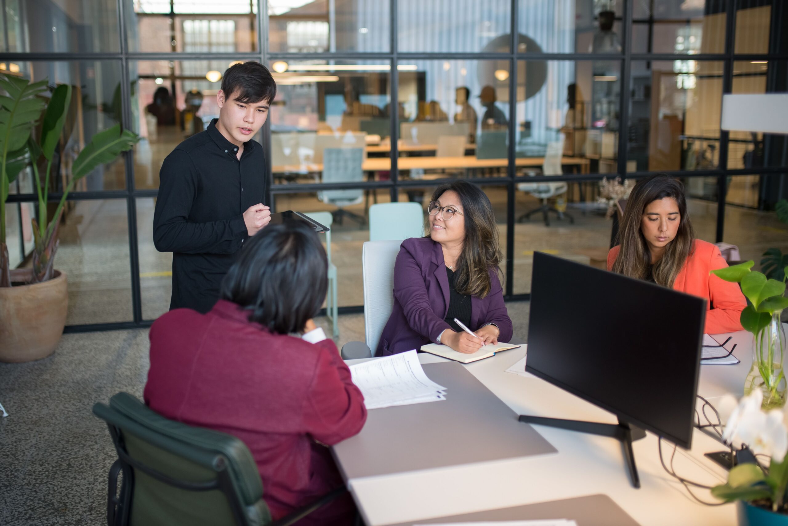 People in the middle of a meeting.